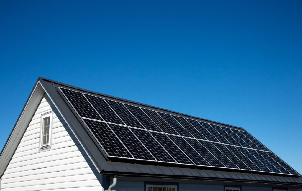 A house with solar panels. blue sky